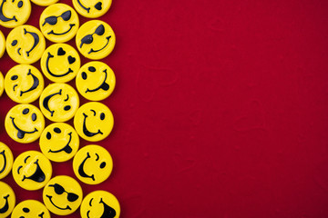 Happy faces on red background, smiling border