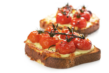 Cherry truss tomatoes over melting grilled cheese
