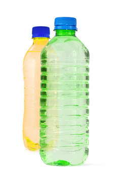 two bottles full of water against white background,
