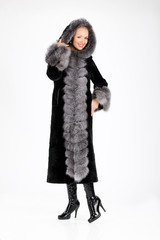 Young attractive woman in furcoat