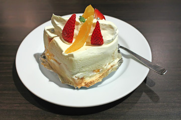White Sponge Cream Cake in a Restaurant