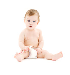 picture of baby boy in diaper with toothbrush