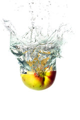 ripe apple falling in the water