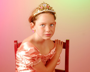 Young princess girl looking serious in chair © Cheryl Casey
