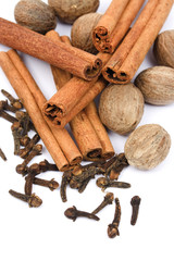 Nutmeg, cinnamon sticks and cloves isolated on white background