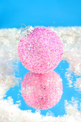 pink sparkly christmas ball with reflection