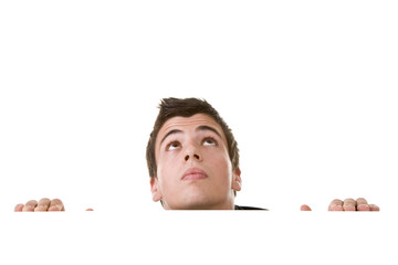 Young man, looking up with curious expression.