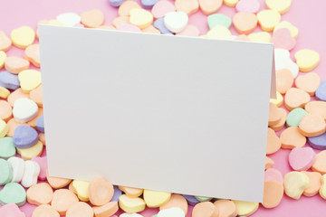 Blank card on a candy heart background