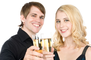 An attractive young couple drinking champagne together