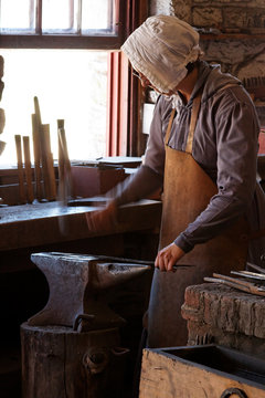 Woman Blacksmithing