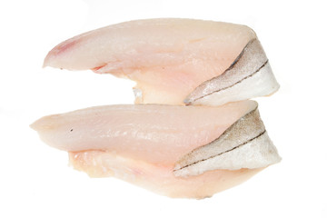 Two haddock fillets on a white background