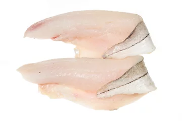 Fototapeten Two haddock fillets on a white background © Richard Griffin