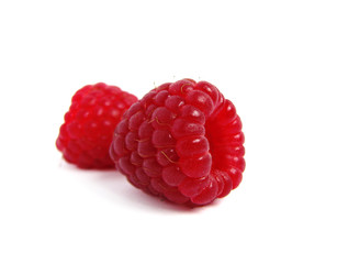 Two raspberriees isolated on white background