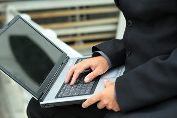 Business background: handsome businessman in a work process.