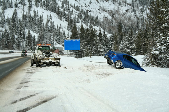 Car Stuck In A Snow Bank On The Side Of The Highway