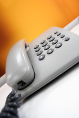 a simple grey office phone