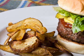 nice big juicy hamburger on a white plate