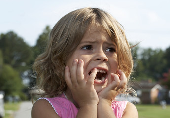 a picture of a cute little girl scared - 8962971