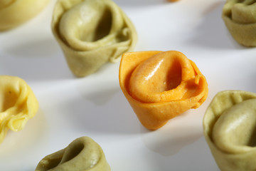 green, natural, red kind of pasta tortellini.