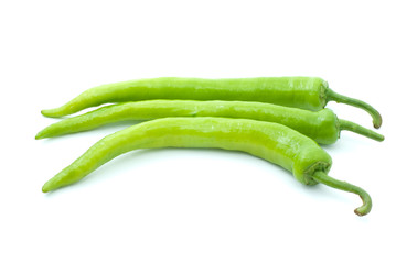 Three green chili peppers isolated on the white background