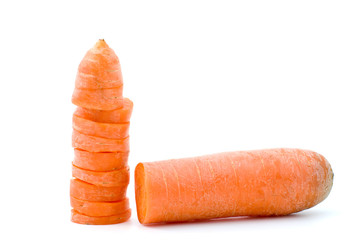 Half of carrot and few slices isolated on the white background