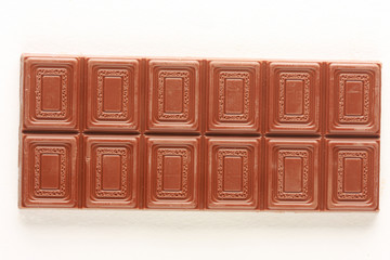 Milk chocolate bar isolated on white, shot in studio