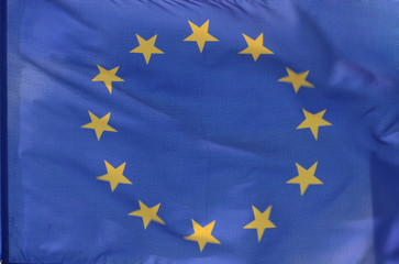 The flag of the european union, parts of it blurry due to  wind