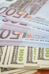 money eur and dollars on table