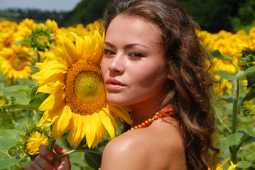 portrait of the beautiful girl with flowers