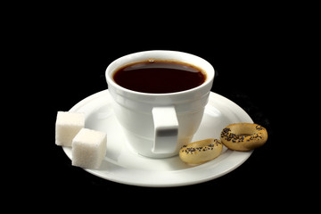Cup of black coffee on the black background