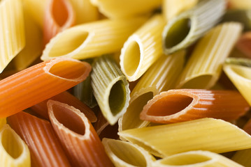 mixed raw pasta background close up shoot