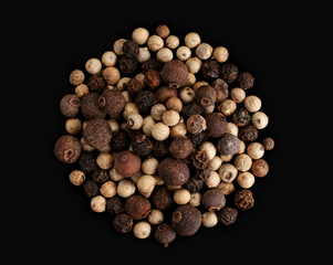 Dry spice pepper pea detail view on black