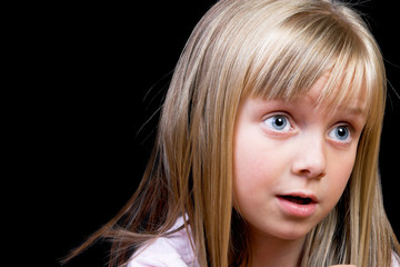 Blond Girl with big blue eyes on a black background