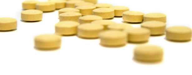 Tablets on white background. Isolation, shallow DOF.