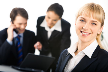 Image of happy businesswoman looking at camera