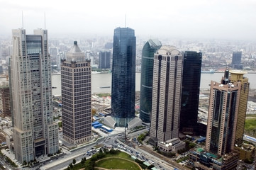 Aerial view of Shanghai city with skyscrapers and Huangpu river