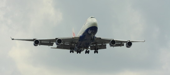 Airplane on a cloudy sky