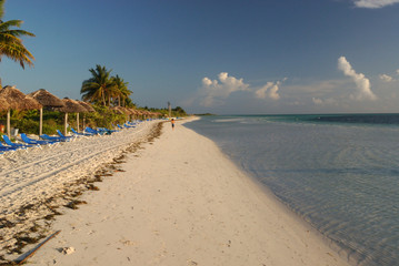 Man running on the empty Carribean beach