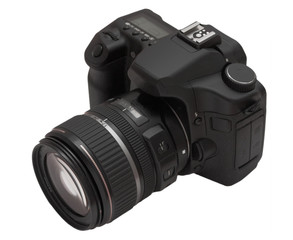 The film camera with an objective on a white background