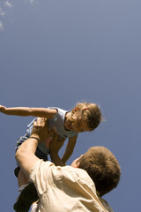 Father and daughter on the sky