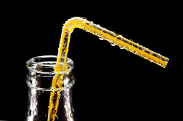 bottle and tube isolated on black