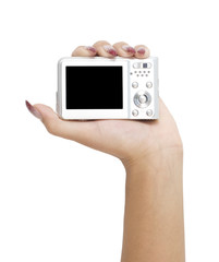 digital camera in a hand isolated on white