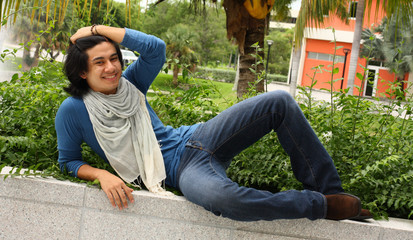 Man relaxing on a ledge