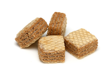 Cappuccino cream filled wafer cubes on white background.
