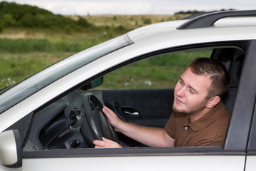 casual man traveling by car