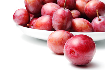 Plums on a white background