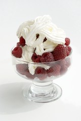 sweet raspberries with creamand sugar as dessert