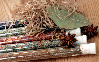 Obraz premium spices in a glass on wood table