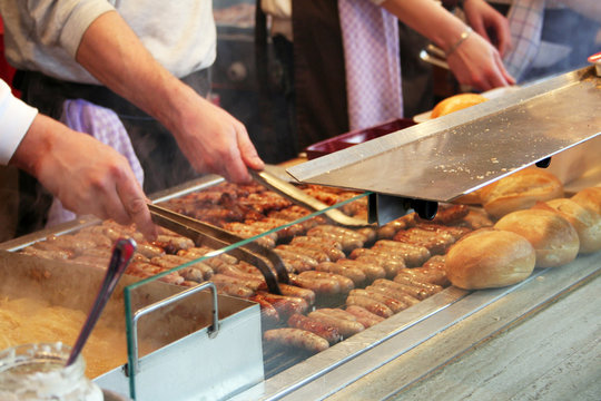 Bratwurste are being prepared in this hot dog stall in Germany