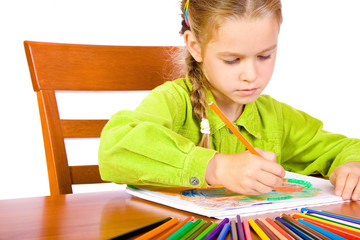 Sitting young girl with crayons